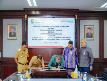 Bupati Kampar tandatangani Perjanjian Kerjasama  Tentang Penerbitan KKPD Di Kab. Kampar